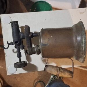 Antique brass hand held torch from the 30s inbthe coal mines sets about a footal